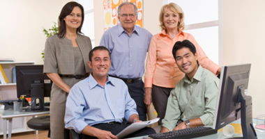 team members seated and standing